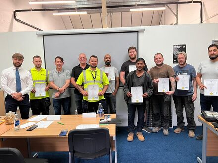 Eight newly qualified window insulation specialists from MEG holding their certificates